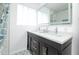 Bright bathroom with double vanity, stylish fixtures, and updated shower/tub combo at 4010 E Catalina Dr, Phoenix, AZ 85018