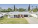 Charming single-story home featuring a carport and well-maintained front lawn at 4010 E Catalina Dr, Phoenix, AZ 85018