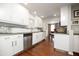 Updated kitchen featuring sleek, white cabinets, stainless steel appliances, and hardwood floors at 4010 E Catalina Dr, Phoenix, AZ 85018