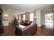 Spacious living room with hardwood floors, stylish furniture, and plenty of natural light at 4010 E Catalina Dr, Phoenix, AZ 85018