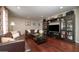 Comfortable living room featuring hardwood floors, stylish sofas, and built in storage shelves at 4010 E Catalina Dr, Phoenix, AZ 85018