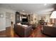 Open living room with hardwood floors flowing into the adjacent dining area at 4010 E Catalina Dr, Phoenix, AZ 85018