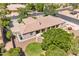 Home's outdoor space featuring a refreshing pool, covered patio and lush lawn at 4061 E Hope St, Mesa, AZ 85205