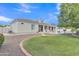 Backyard featuring a lawn, landscaping, covered patio, and view of the house at 4061 E Hope St, Mesa, AZ 85205