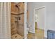Bathroom featuring a shower, toilet, tile flooring, and a vanity outside the doorway at 4061 E Hope St, Mesa, AZ 85205