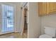 Bathroom featuring a shower, toilet, tile flooring, and a door to the backyard pool at 4061 E Hope St, Mesa, AZ 85205