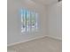 Neutral bedroom featuring a window with shutters and carpet at 4061 E Hope St, Mesa, AZ 85205