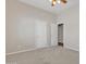 Bedroom featuring plush carpet, ceiling fan, and two white doors at 4061 E Hope St, Mesa, AZ 85205