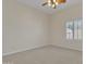 Bedroom features a ceiling fan, carpeted floors, and a window with white shutters at 4061 E Hope St, Mesa, AZ 85205