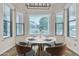 Bright breakfast nook with a round table, seating, and a view to the outdoors at 4061 E Hope St, Mesa, AZ 85205