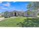 Charming single-story home with well-manicured lawn and mature trees at 4061 E Hope St, Mesa, AZ 85205