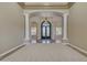 Grand foyer with decorative iron doors and view of additional rooms at 4061 E Hope St, Mesa, AZ 85205