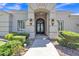 Elegant front entrance with decorative iron doors and manicured landscaping at 4061 E Hope St, Mesa, AZ 85205
