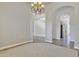 Open hallway view with archways and neutral paint, showcasing the home's spacious design at 4061 E Hope St, Mesa, AZ 85205