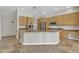 Spacious kitchen with stainless steel appliances, granite countertops, and ample cabinet space at 4061 E Hope St, Mesa, AZ 85205