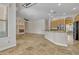 Spacious living room with travertine floors, ceiling fan, and natural light at 4061 E Hope St, Mesa, AZ 85205