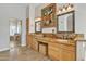 Main bathroom featuring dual sinks with granite countertops and a vanity at 4061 E Hope St, Mesa, AZ 85205