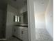 Bathroom featuring a double vanity, large mirror, and modern fixtures at 4345 E Brook Lynn Pl, San Tan Valley, AZ 85143