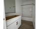 A bright bathroom with new vanity cabinets and a shower-tub combination at 4345 E Brook Lynn Pl, San Tan Valley, AZ 85143