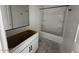 Bathroom featuring white cabinets, framed mirror, and a bathtub-shower combo unit at 4345 E Brook Lynn Pl, San Tan Valley, AZ 85143