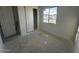 Bedroom with window and closet featuring neutral walls and trim, ready for customization at 4345 E Brook Lynn Pl, San Tan Valley, AZ 85143