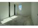 Neutral bedroom featuring a window and a closet with sliding doors at 4345 E Brook Lynn Pl, San Tan Valley, AZ 85143