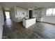 Bright kitchen boasts white cabinets and large island, creating a chef's dream space at 4345 E Brook Lynn Pl, San Tan Valley, AZ 85143
