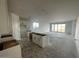 Open kitchen with white cabinetry, unfinished island, offering customization at 4345 E Brook Lynn Pl, San Tan Valley, AZ 85143