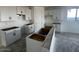 Kitchen featuring white cabinets, island, and modern layout perfect for culinary creativity at 4345 E Brook Lynn Pl, San Tan Valley, AZ 85143