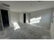 Bright living room with modern lighting, neutral walls, and an open floor plan at 4345 E Brook Lynn Pl, San Tan Valley, AZ 85143