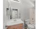 Bathroom featuring a single sink vanity, toilet, shower/tub combo and neutral wall paint at 43507 W Cydnee Dr, Maricopa, AZ 85138