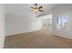 Spacious bedroom with vaulted ceiling, ceiling fan and plantation shutters at 43507 W Cydnee Dr, Maricopa, AZ 85138
