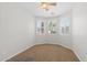 Cozy bedroom with carpeted floors, a ceiling fan, and natural light from the windows at 43507 W Cydnee Dr, Maricopa, AZ 85138