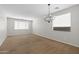 Spacious bedroom featuring plush carpet, white walls, and ample natural light at 43507 W Cydnee Dr, Maricopa, AZ 85138