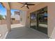 Covered patio with a ceiling fan and views of the large backyard at 43507 W Cydnee Dr, Maricopa, AZ 85138