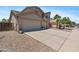Charming home with a three-car garage, desert landscaping, and a spacious driveway at 43507 W Cydnee Dr, Maricopa, AZ 85138