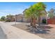 Charming home with desert landscaping, a three car garage, and mature palm trees at 43507 W Cydnee Dr, Maricopa, AZ 85138