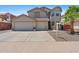 Charming two-story home with a three-car garage and well-maintained landscaping at 43507 W Cydnee Dr, Maricopa, AZ 85138