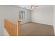 Upstairs loft featuring carpeting and a window with a view at 43507 W Cydnee Dr, Maricopa, AZ 85138