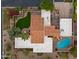 Luxury home featuring a terracotta roof, lush lawn, pool, and outdoor seating area at 4450 E Camelback Rd # 4, Phoenix, AZ 85018