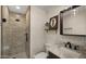 Modern bathroom featuring a walk-in shower with stylish tile and matte black fixtures at 4450 E Camelback Rd # 4, Phoenix, AZ 85018
