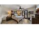 Comfortable bedroom featuring access to the outdoors and decorations on the wall at 4450 E Camelback Rd # 4, Phoenix, AZ 85018