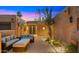 Inviting courtyard with comfortable seating, a paver walkway, and desert landscaping at 4450 E Camelback Rd # 4, Phoenix, AZ 85018