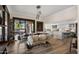 Dining area with seating for eight with views through sliding glass doors to outdoor entertainment area at 4450 E Camelback Rd # 4, Phoenix, AZ 85018