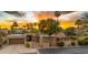 Stunning home featuring lush desert landscaping, a two-car garage, and a charming front gate at 4450 E Camelback Rd # 4, Phoenix, AZ 85018