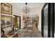 Elegant foyer boasting wood-look tile, decorative lighting, and a glimpse into the home's interior at 4450 E Camelback Rd # 4, Phoenix, AZ 85018