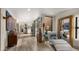 Inviting hallway with neutral walls, decorative art, and sliding doors to outdoor patio at 4450 E Camelback Rd # 4, Phoenix, AZ 85018