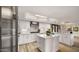 Spacious kitchen featuring stainless steel appliances, a center island, and wood-look flooring at 4450 E Camelback Rd # 4, Phoenix, AZ 85018
