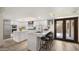 Bright open kitchen with stainless appliances, skylight, kitchen island, and breakfast bar at 4450 E Camelback Rd # 4, Phoenix, AZ 85018