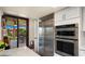 Bright kitchen area showcasing stainless steel appliances, including a refrigerator and double ovens at 4450 E Camelback Rd # 4, Phoenix, AZ 85018